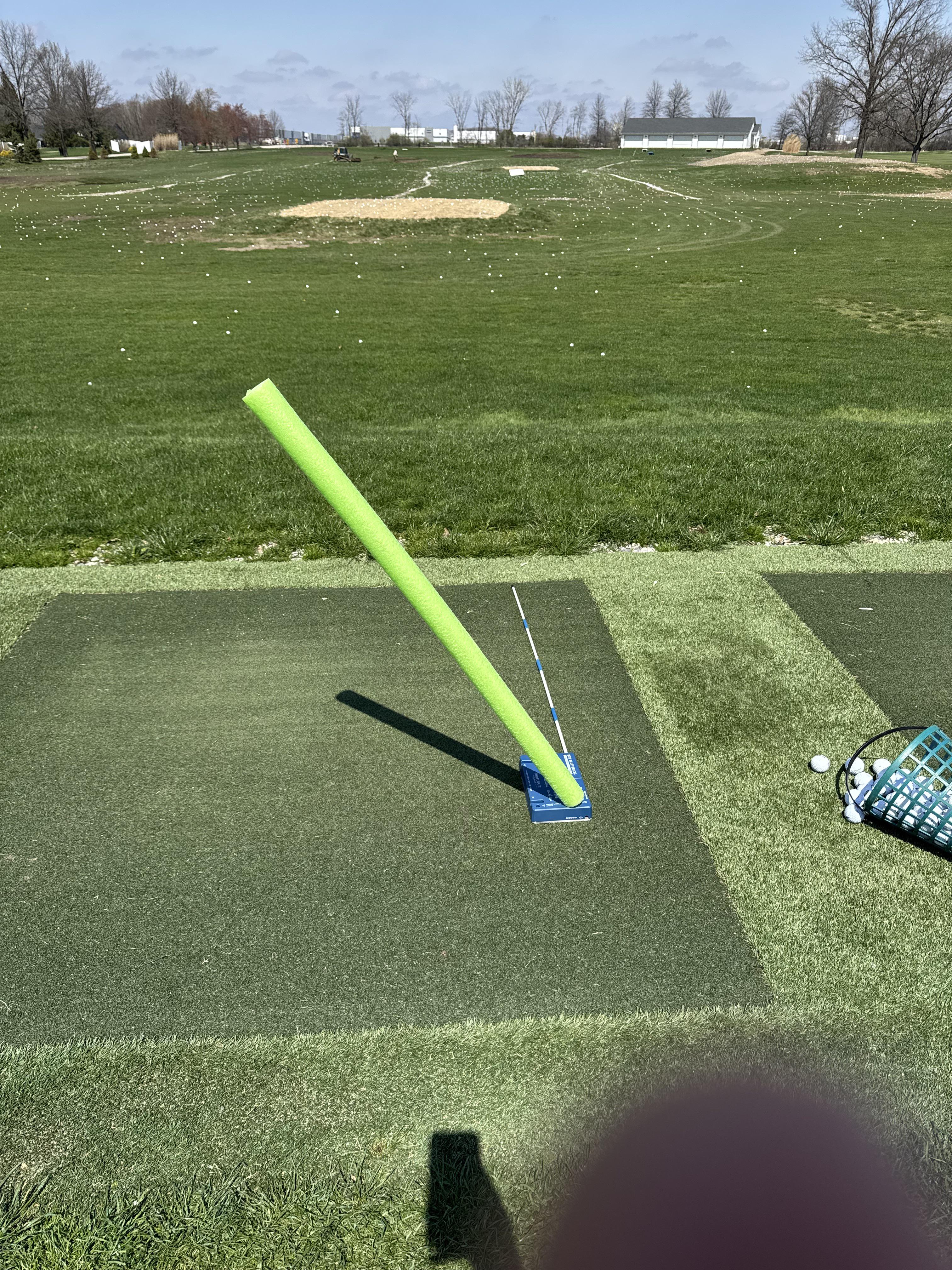 Blue Brick with pool noodle protection on driving range