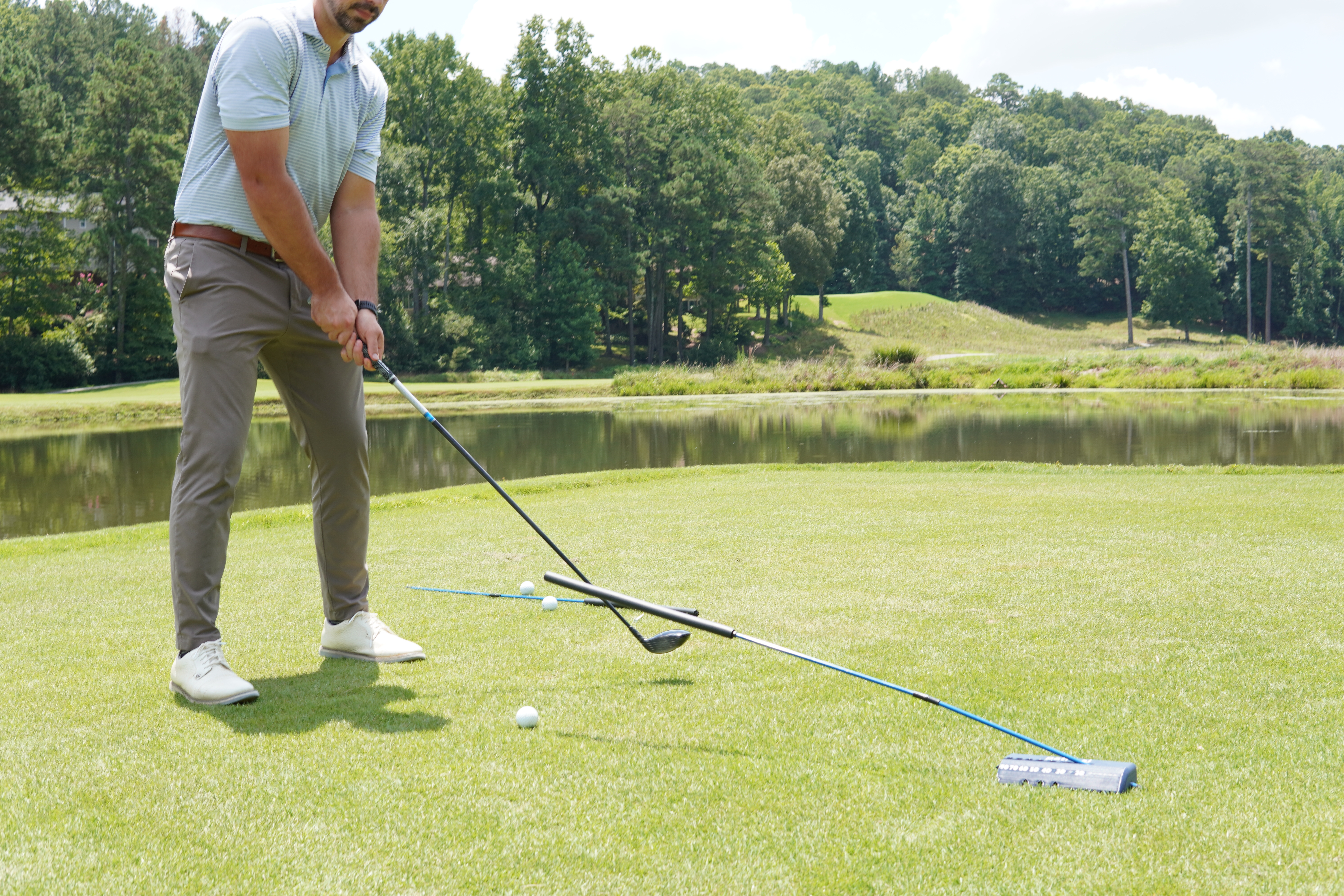 Golfer using pathpal at 20 degree angle with driver